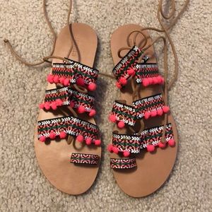 strappy lace up pom pom sandals